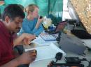 Radio activity in the GOTA Tent:  Senthil, KJ6KCG, coaches a visitor in the GOTA tent.